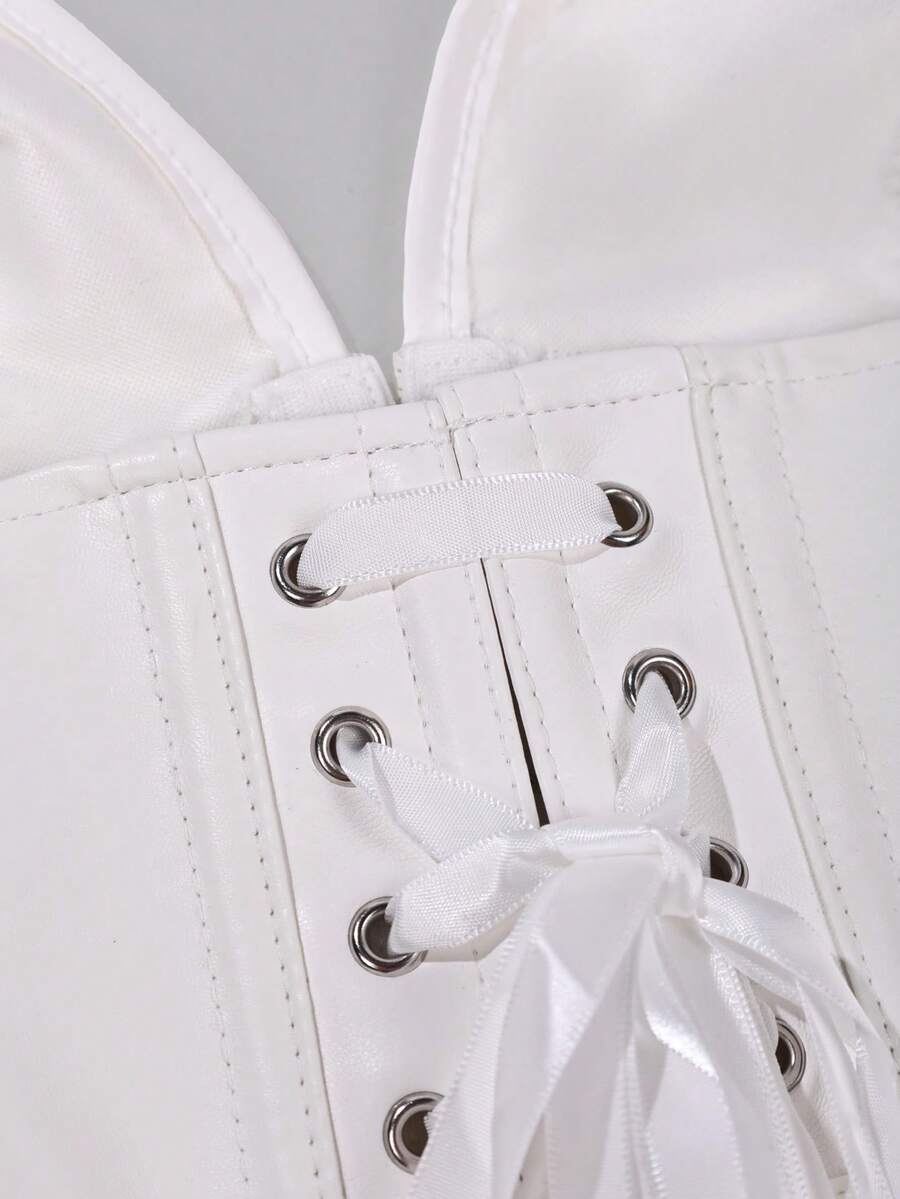 Retro PU halter tank top featuring a deep V-neck, grommet eyelet halter strap, tie back, boned details, and an asymmetrical hem.