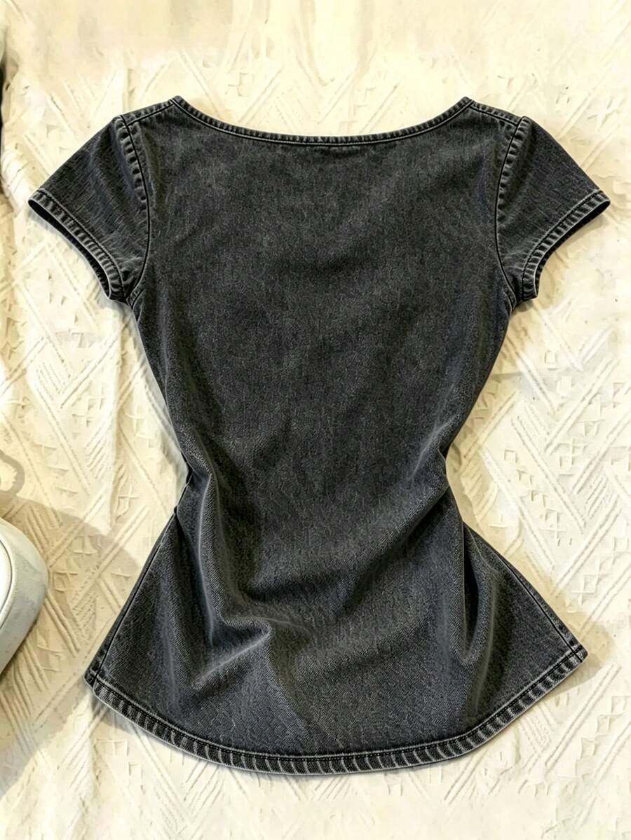 Women's polka dot short sleeve raglan t-shirt with a twist front detail and contrast collar.