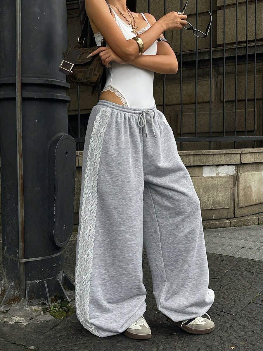 Women's wide leg trousers with a tree branch graphic pattern, loose fit, and mid-rise waist in woven fabric.