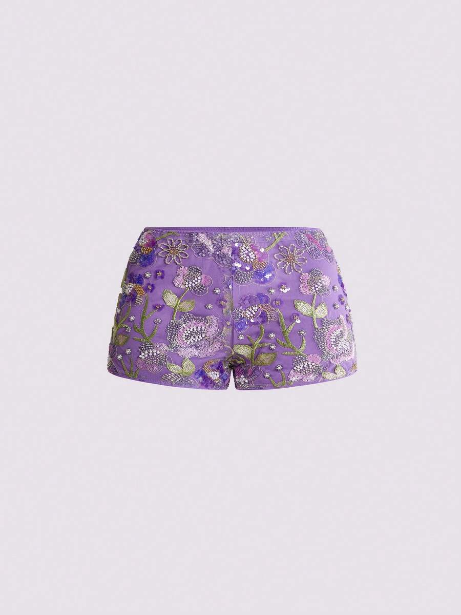 Women's ultra low waist shiny sequin mini shorts featuring a zipper fly, button closure, and high-stretch lined fabric for festival and night out outfits.