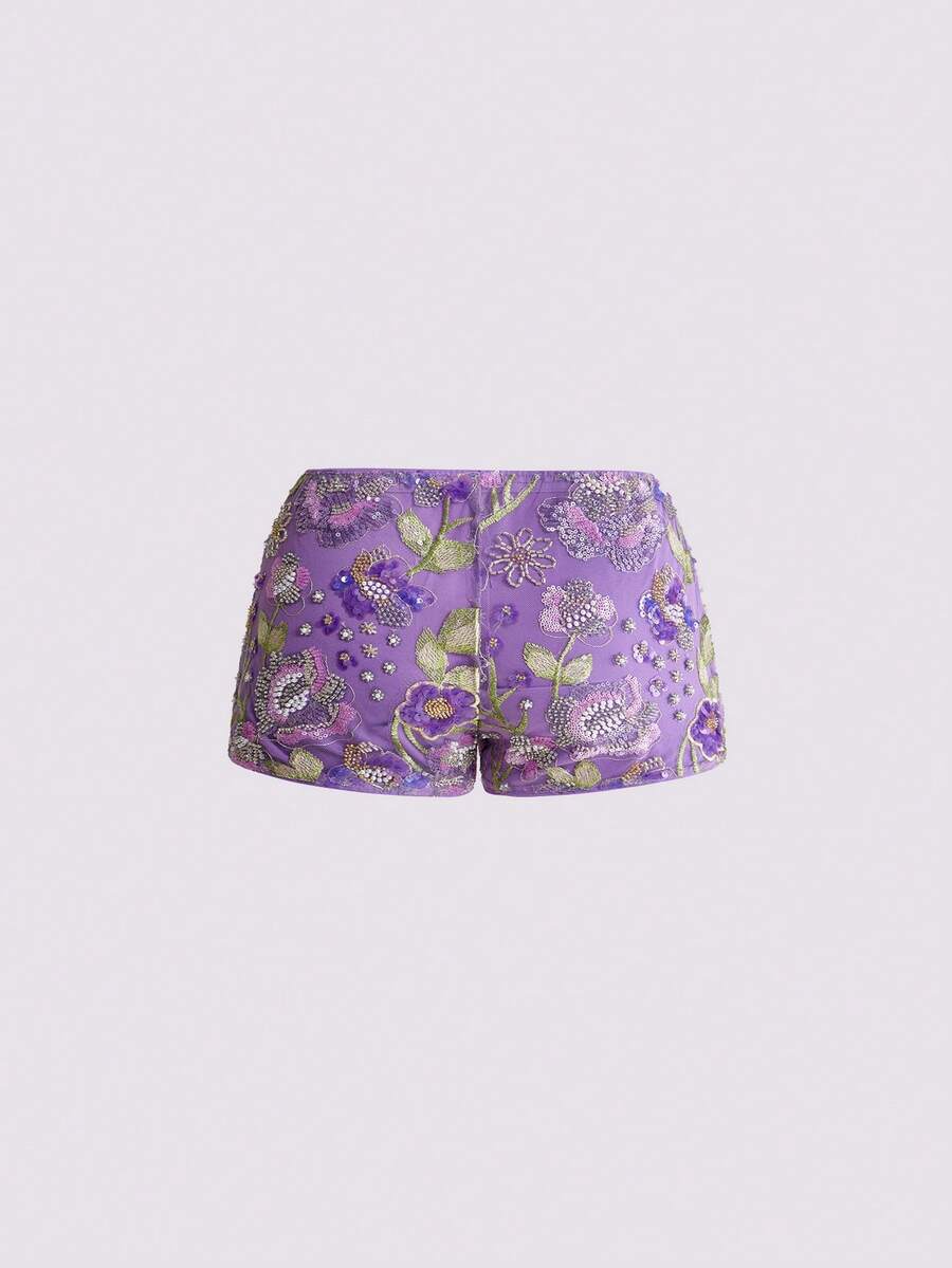Women's ultra low waist shiny sequin mini shorts featuring a zipper fly, button closure, and high-stretch lined fabric for festival and night out outfits.