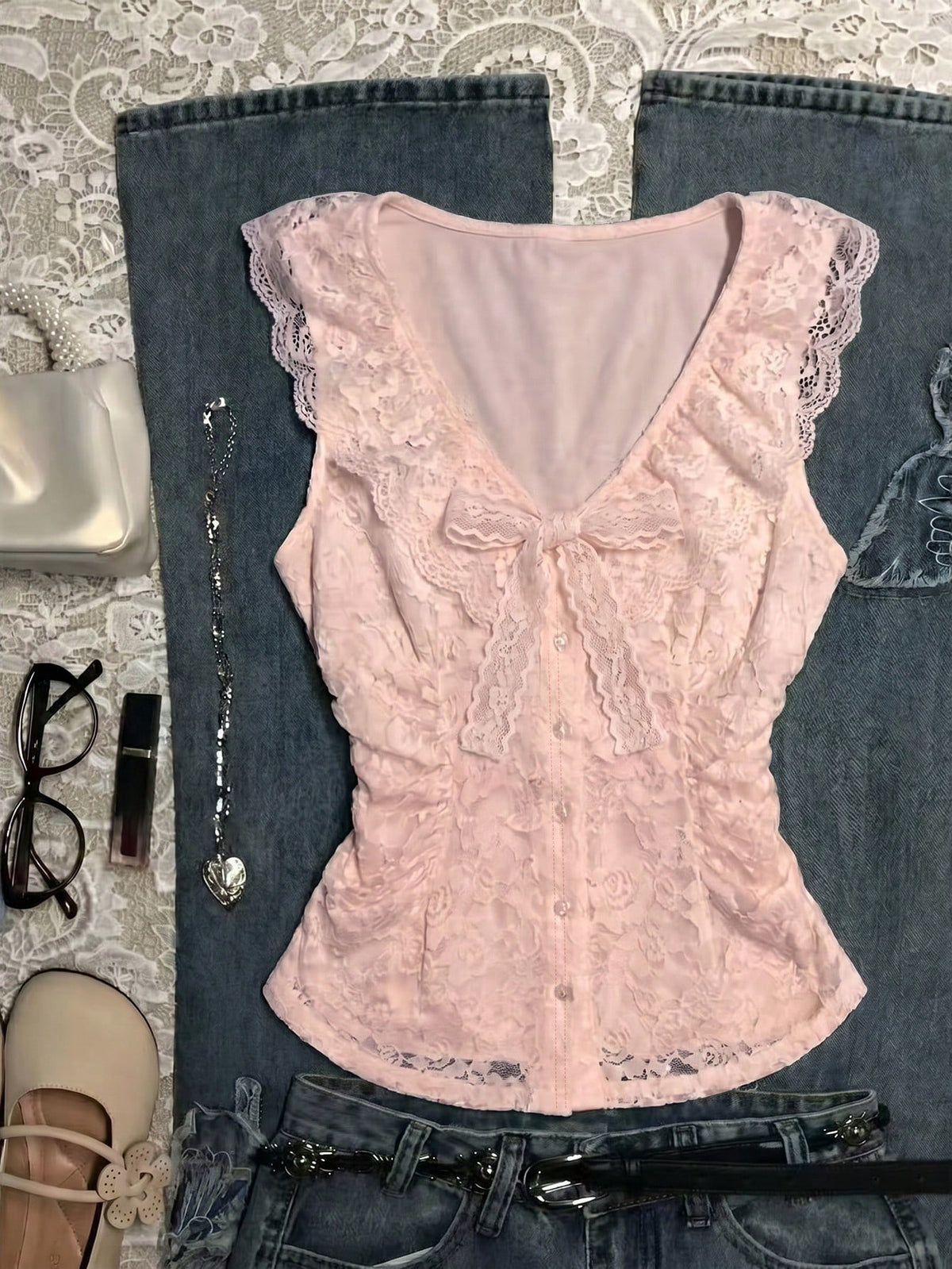 Franclia women's slim fit V-neck sleeveless tank top featuring lace patchwork detailing and a bow accent.