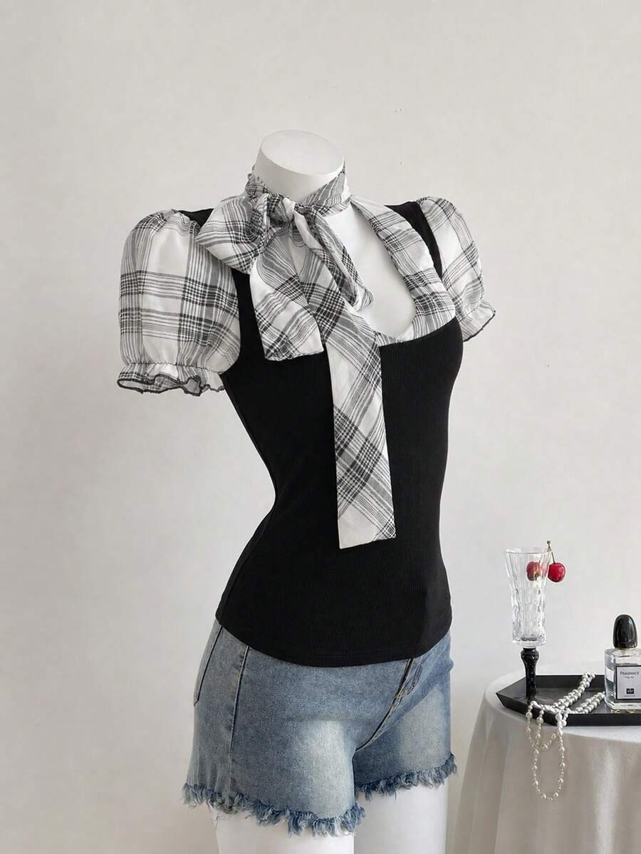 Women's slim fit short sleeve t-shirt featuring puff sleeves, Queen Anne neckline, tie-up front knot, frill detail, and raw hem.
