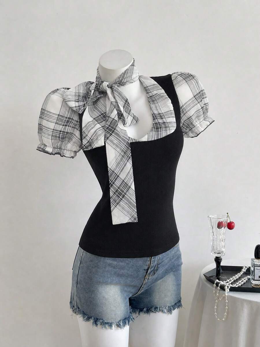 Women's slim fit short sleeve t-shirt featuring puff sleeves, Queen Anne neckline, tie-up front knot, frill detail, and raw hem.