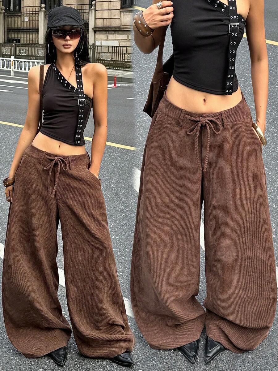 Women's casual straight leg striped woven pants featuring a low waist and zipper fly closure.