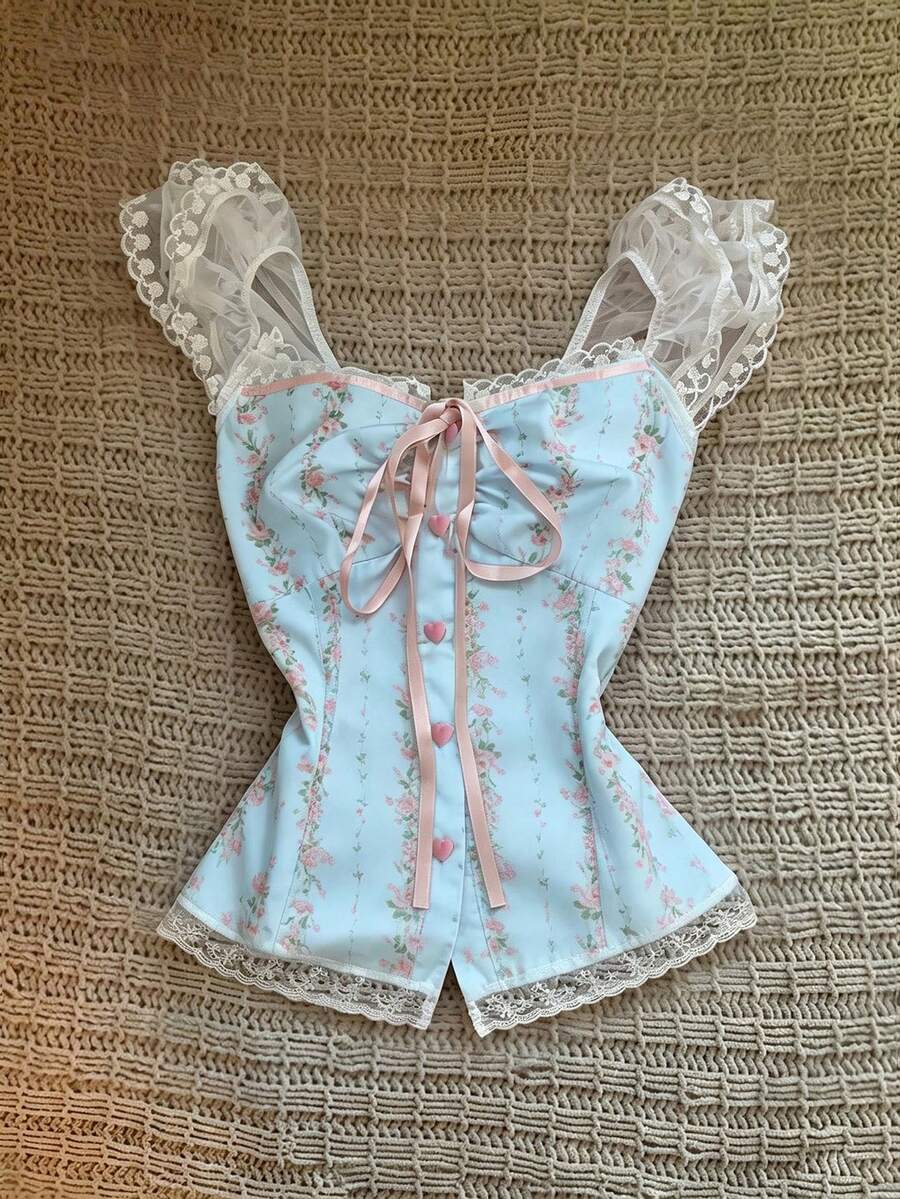 Vintage ditsy floral print sleeveless women's blouse with square neck, ruffle trim, and slim fit style.