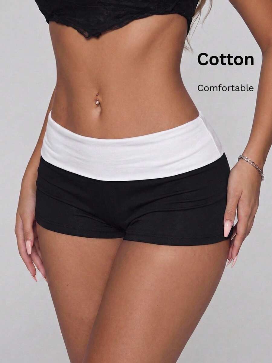 Leopard print foldover waist ultra low rise mini shorts with elastic waistband, skinny fit, and short length.