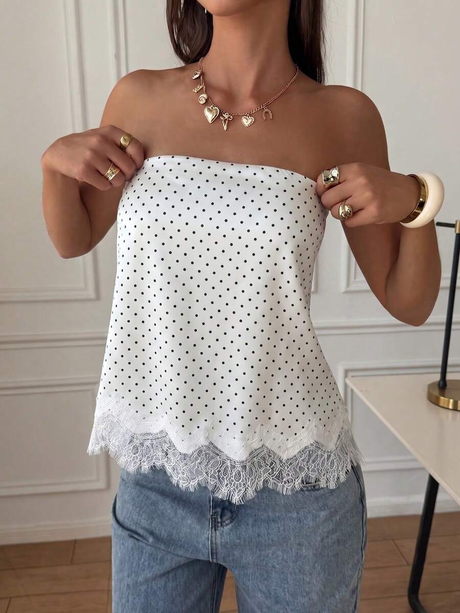 Strapless black and white bandeau top featuring a contrast lace patchwork flared hem and plant pattern.