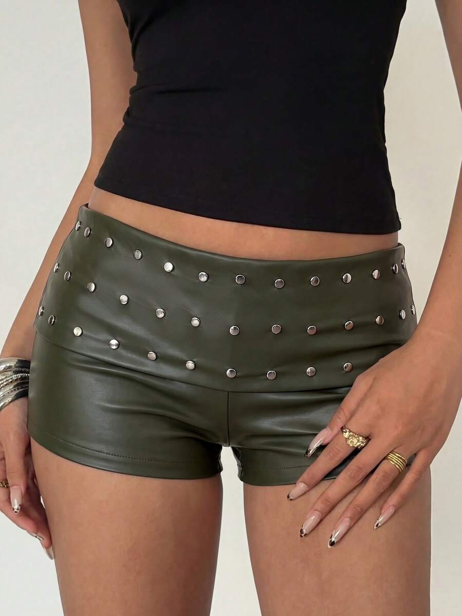 Women's studded PU ultra low waist mini shorts with zipper fly closure, skinny fit, mini length, and plain unlined design.