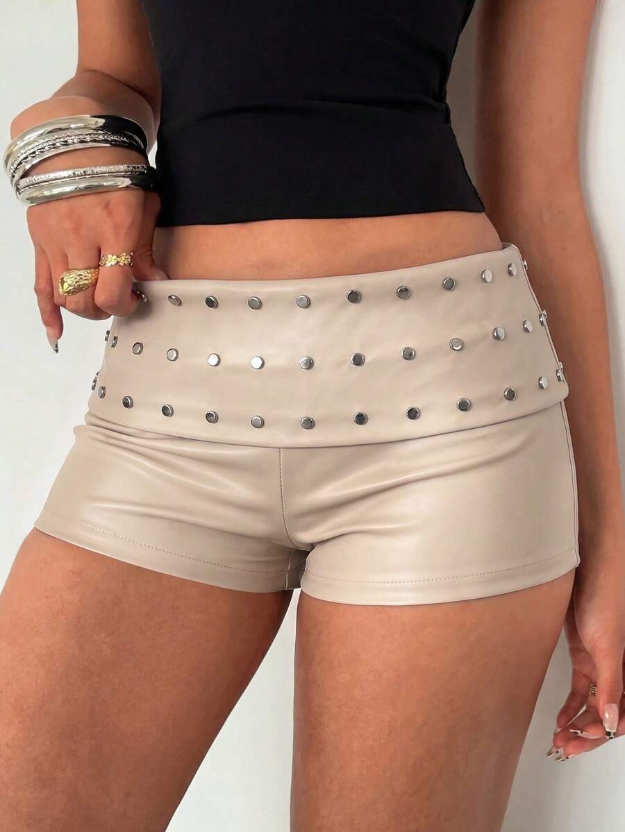 Women's studded PU ultra low waist mini shorts with zipper fly closure, skinny fit, mini length, and plain unlined design.