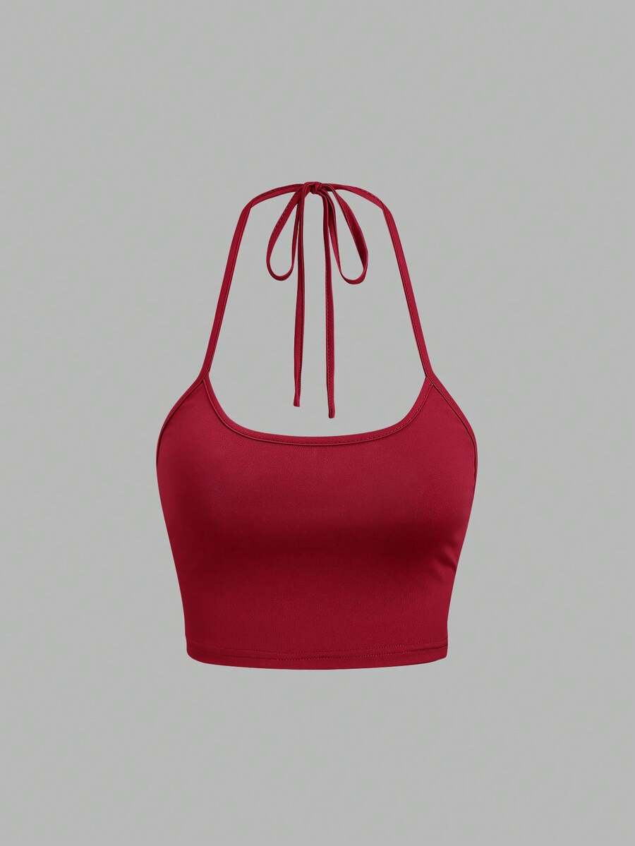 Women's striped tank top featuring an asymmetrical cold shoulder neckline and semi-sheer back.