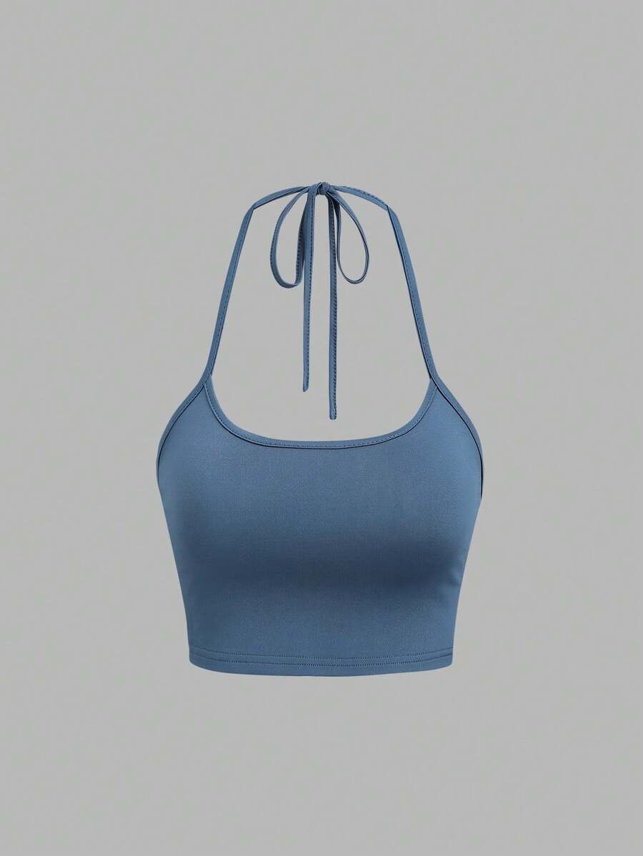Women's striped tank top featuring an asymmetrical cold shoulder neckline and semi-sheer back.