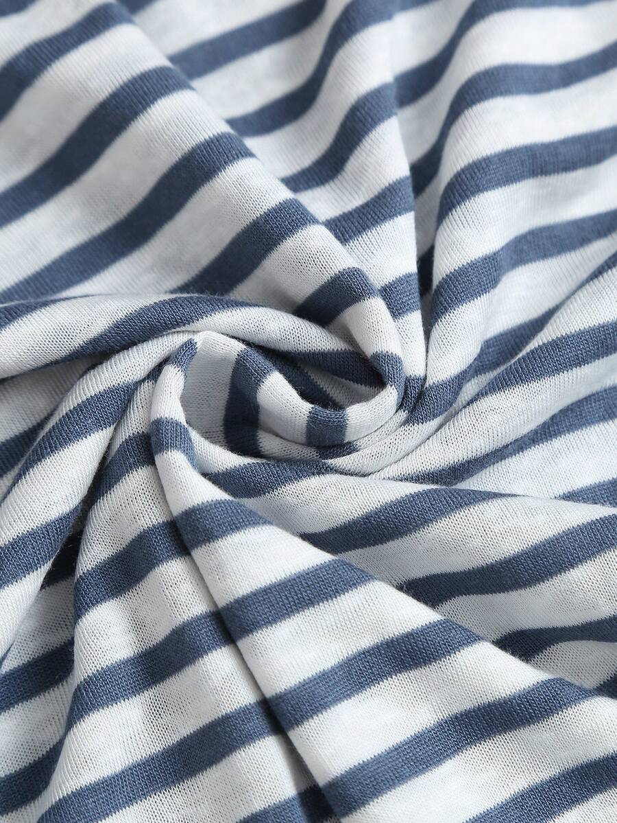 Women's striped tank top featuring an asymmetrical cold shoulder neckline and semi-sheer back.