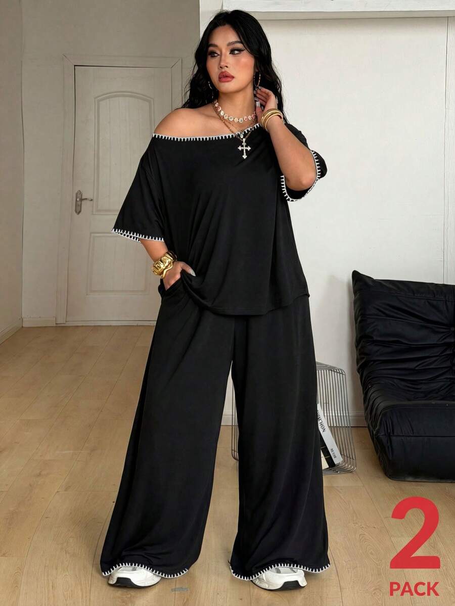 Women's two-piece lounge set featuring a loose drop shoulder asymmetrical neck short sleeve t-shirt and wide-leg knit pants with pockets.