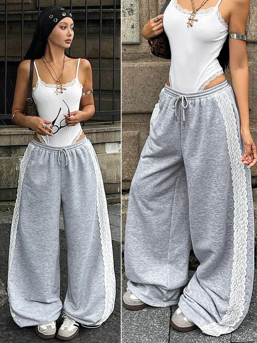 Women's wide leg trousers with a tree branch graphic pattern, loose fit, and mid-rise waist in woven fabric.