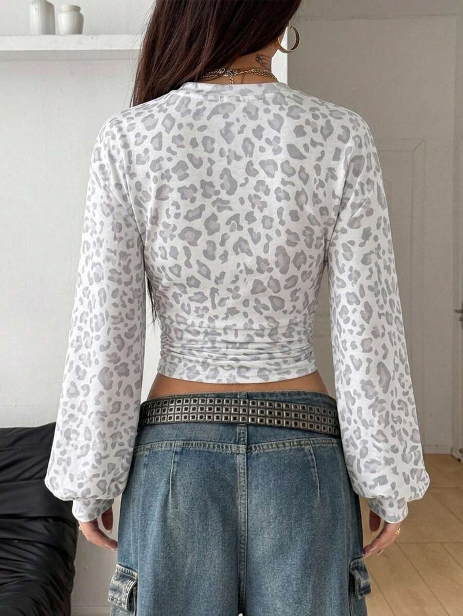Women's brown waist-cinching sweatshirt featuring a round neck, drop shoulder long sleeves, and rib-knit cuffs.