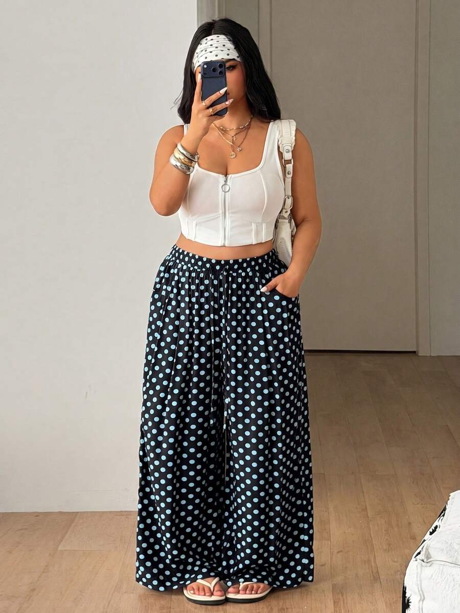 Plus size women's striped loose straight leg cropped pants with pleated detailing and side pockets