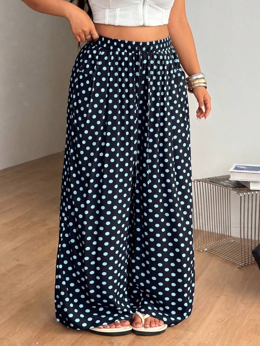 Plus size women's striped loose straight leg cropped pants with pleated detailing and side pockets
