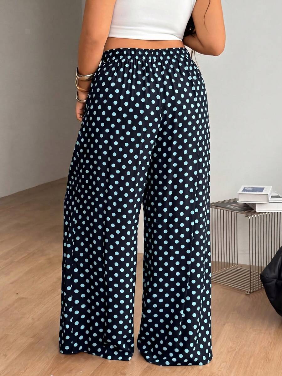 Plus size women's striped loose straight leg cropped pants with pleated detailing and side pockets
