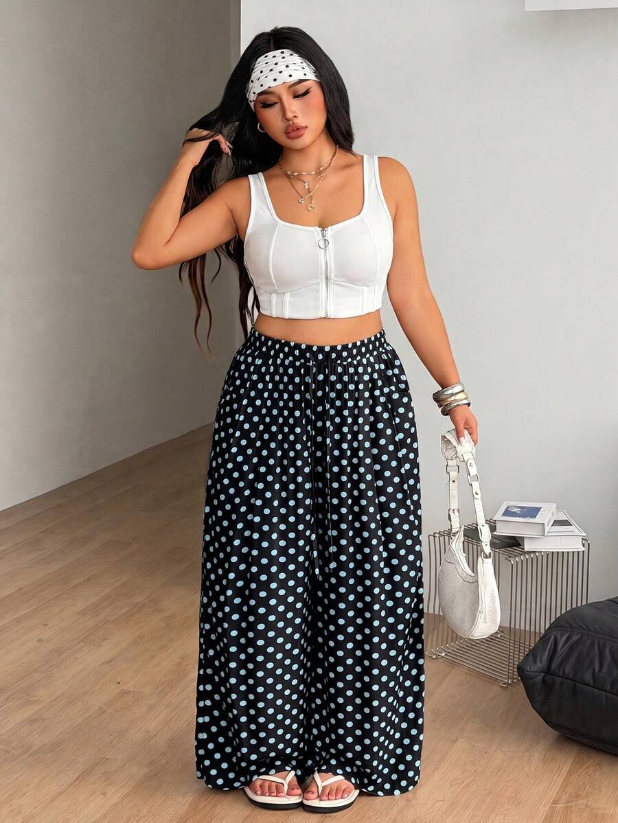 Plus size women's striped loose straight leg cropped pants with pleated detailing and side pockets