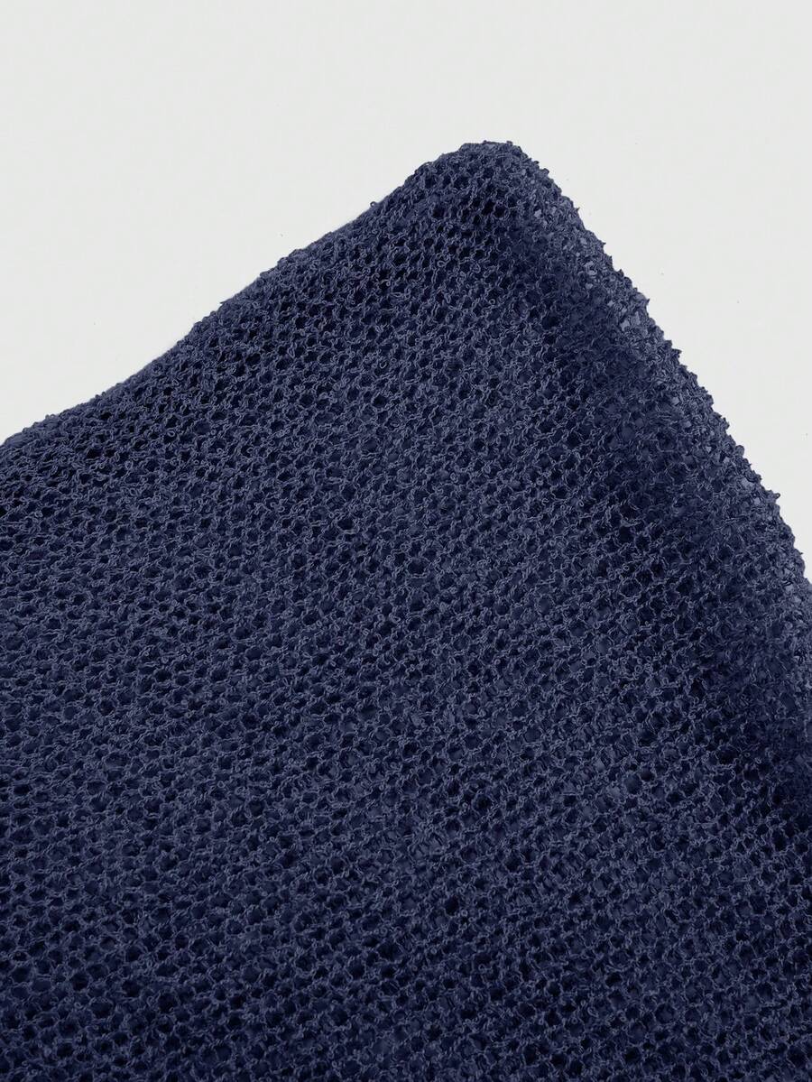 Women's casual hollow knit poncho top with boat neck, cloak sleeves, and asymmetrical hem