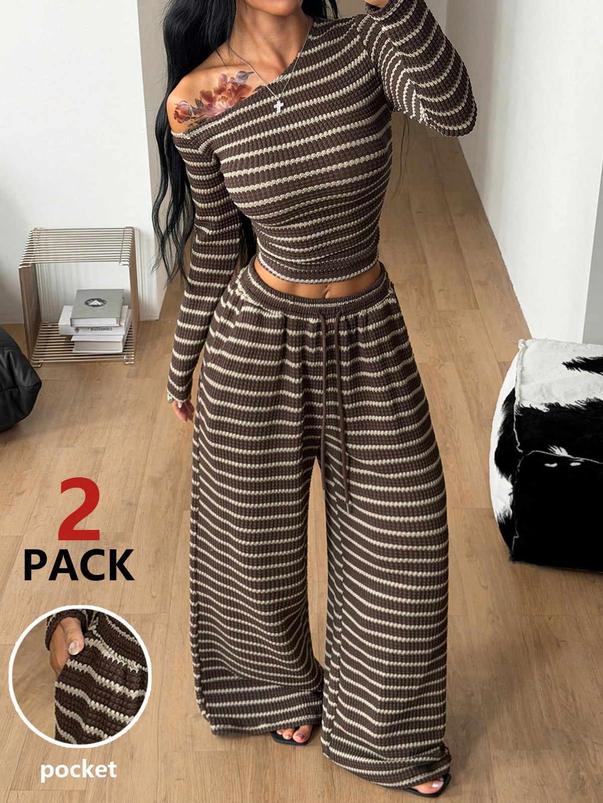 Women's two-piece striped knit tracksuit set featuring a brown asymmetrical neckline long sleeve crop top and matching high-waisted wide leg sweatpants.