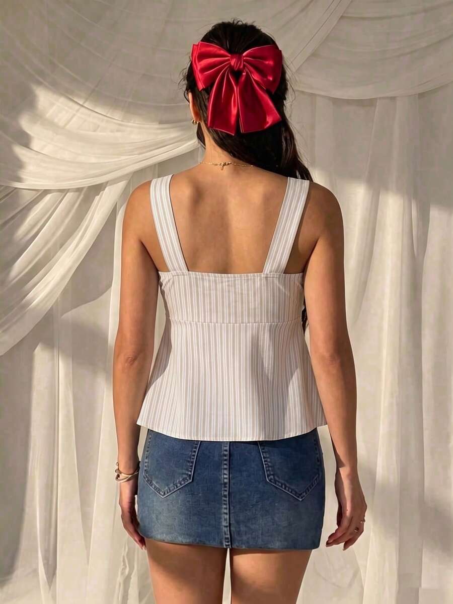 Women's striped camisole tank top with strap neckline, backless knot detail, cold shoulder styling, slim fit, and flared hem for casual vacation or daily wear.