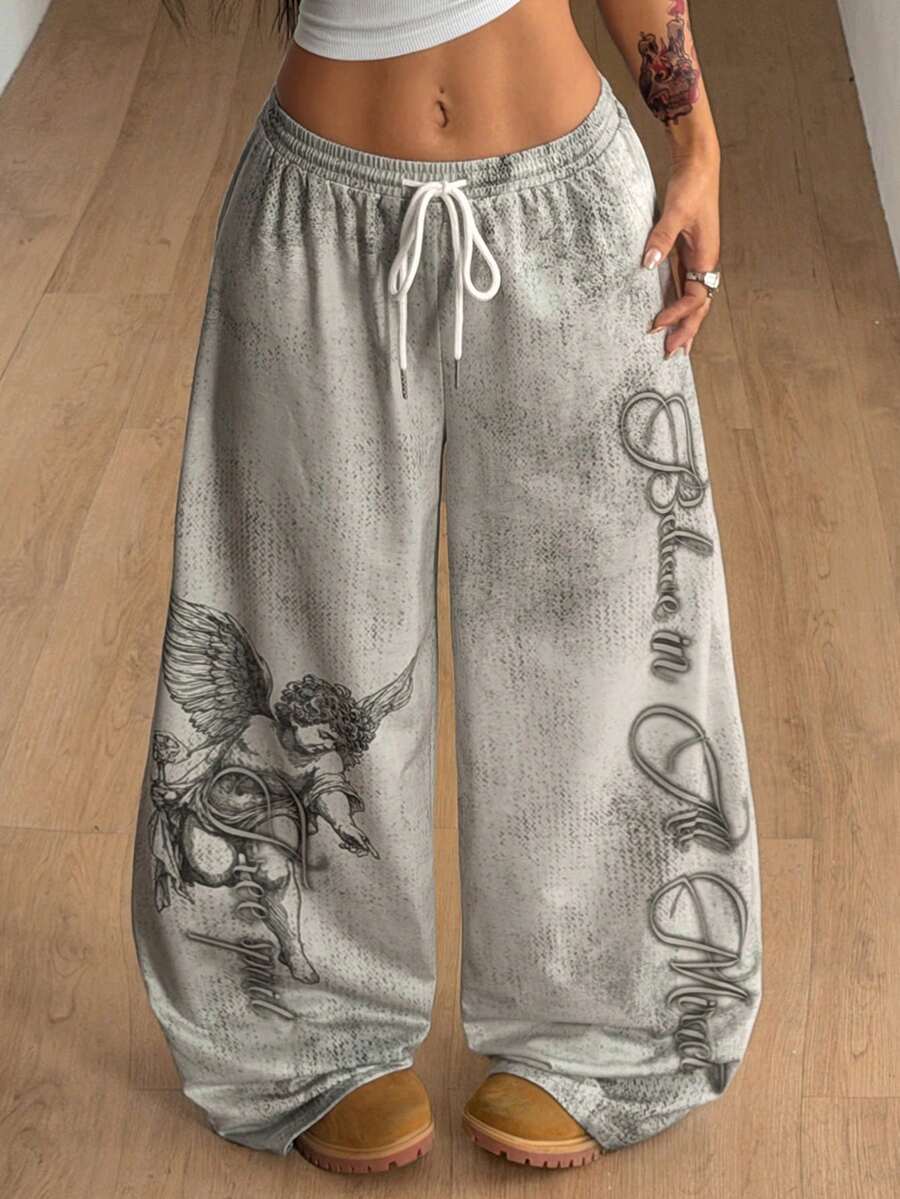 Women's loose fit wide leg graphic sweatpants in light grey with an elastic drawstring waistband