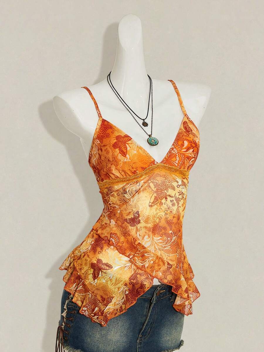 Women's graphic print camisole top featuring thin spaghetti straps, a backless cut, and an asymmetrical hem.