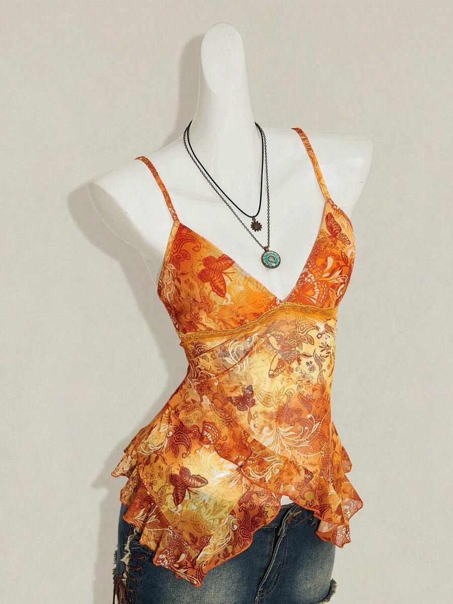 Women's graphic print camisole top featuring thin spaghetti straps, a backless cut, and an asymmetrical hem.