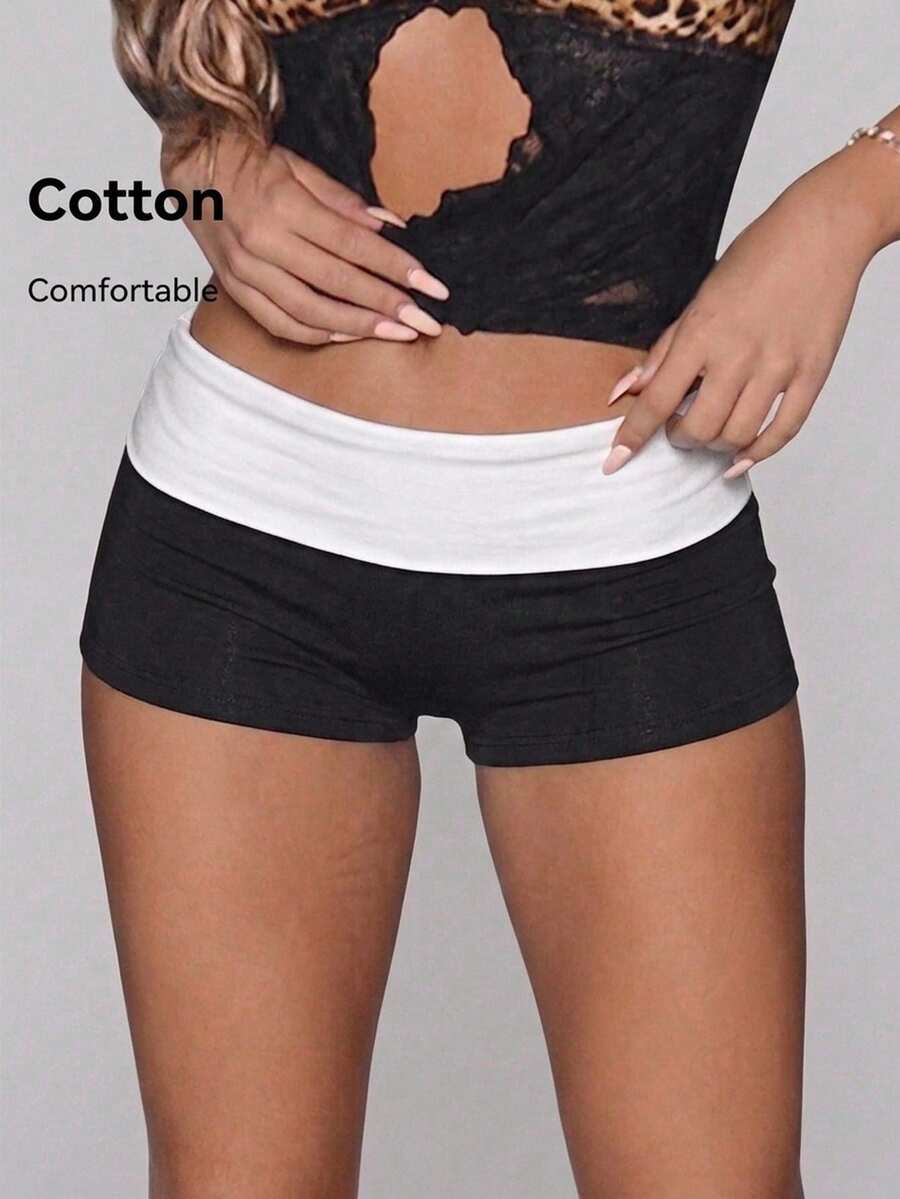 Leopard print foldover waist ultra low rise mini shorts with elastic waistband, skinny fit, and short length.