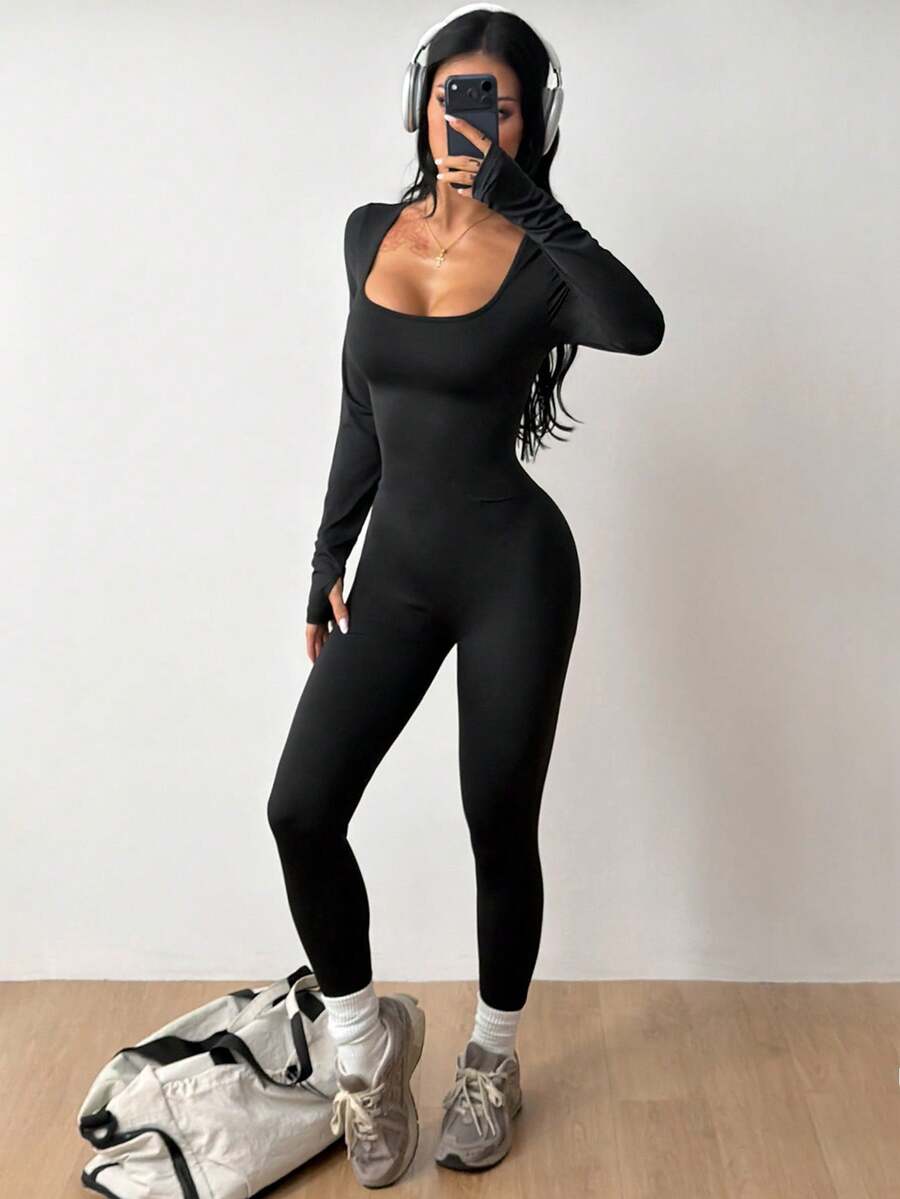 Black square neck long sleeve sport jumpsuit in rib-knit fabric with slim fit unitard silhouette for women.