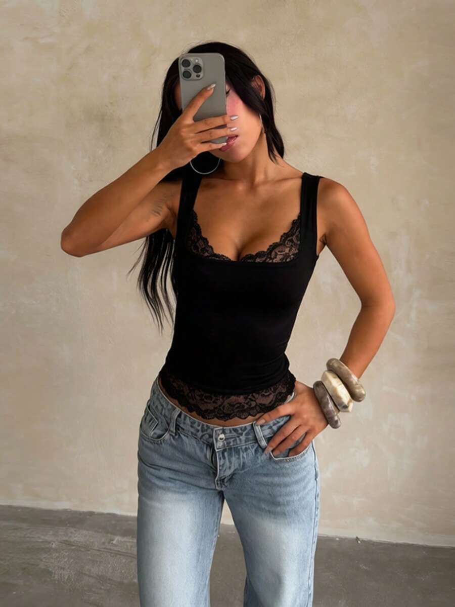 Women's white sleeveless crop tank top with contrast lace details, strap neckline, and graphic plant pattern in a slim fit.