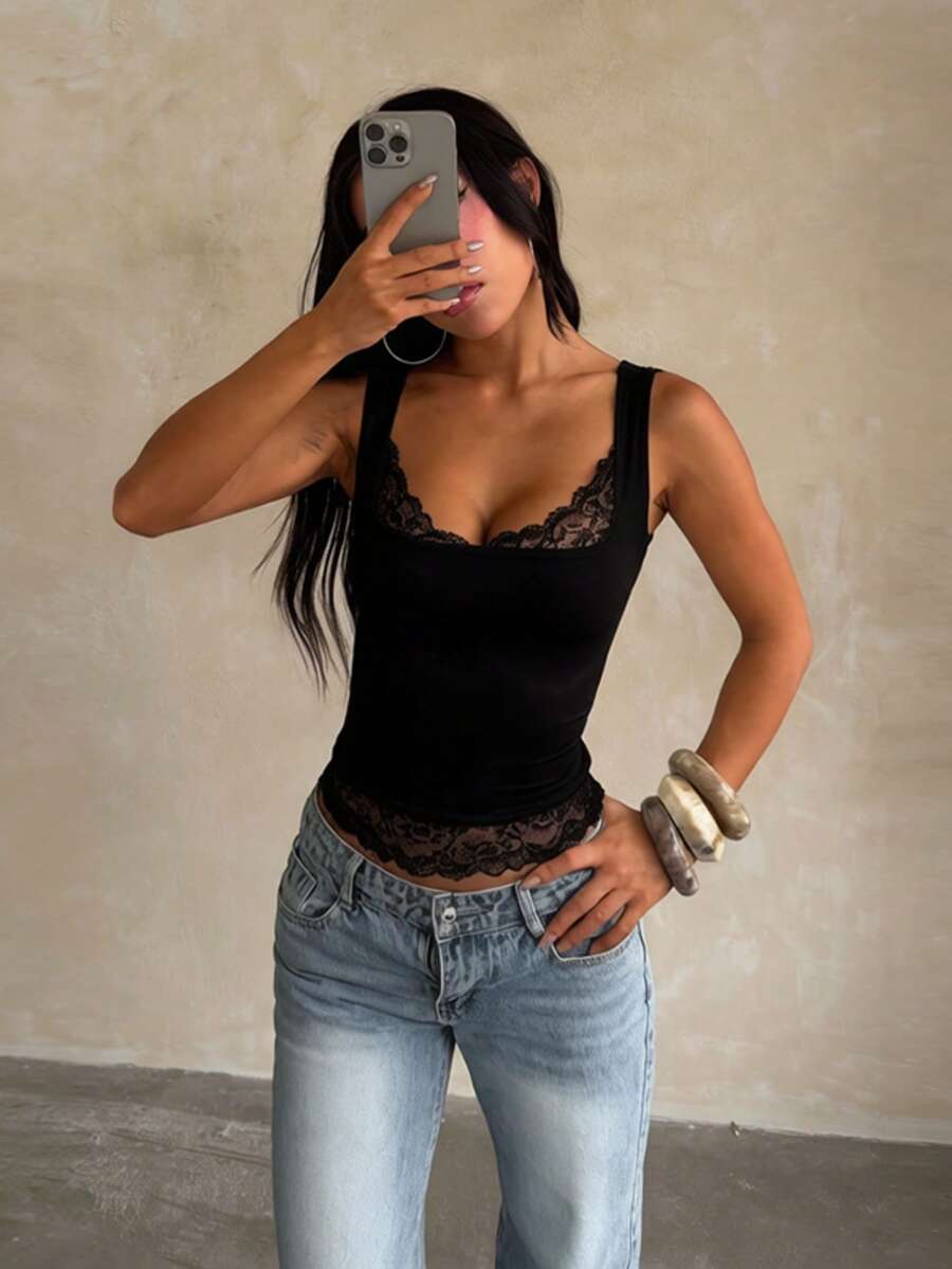 Women's white sleeveless crop tank top with contrast lace details, strap neckline, and graphic plant pattern in a slim fit.
