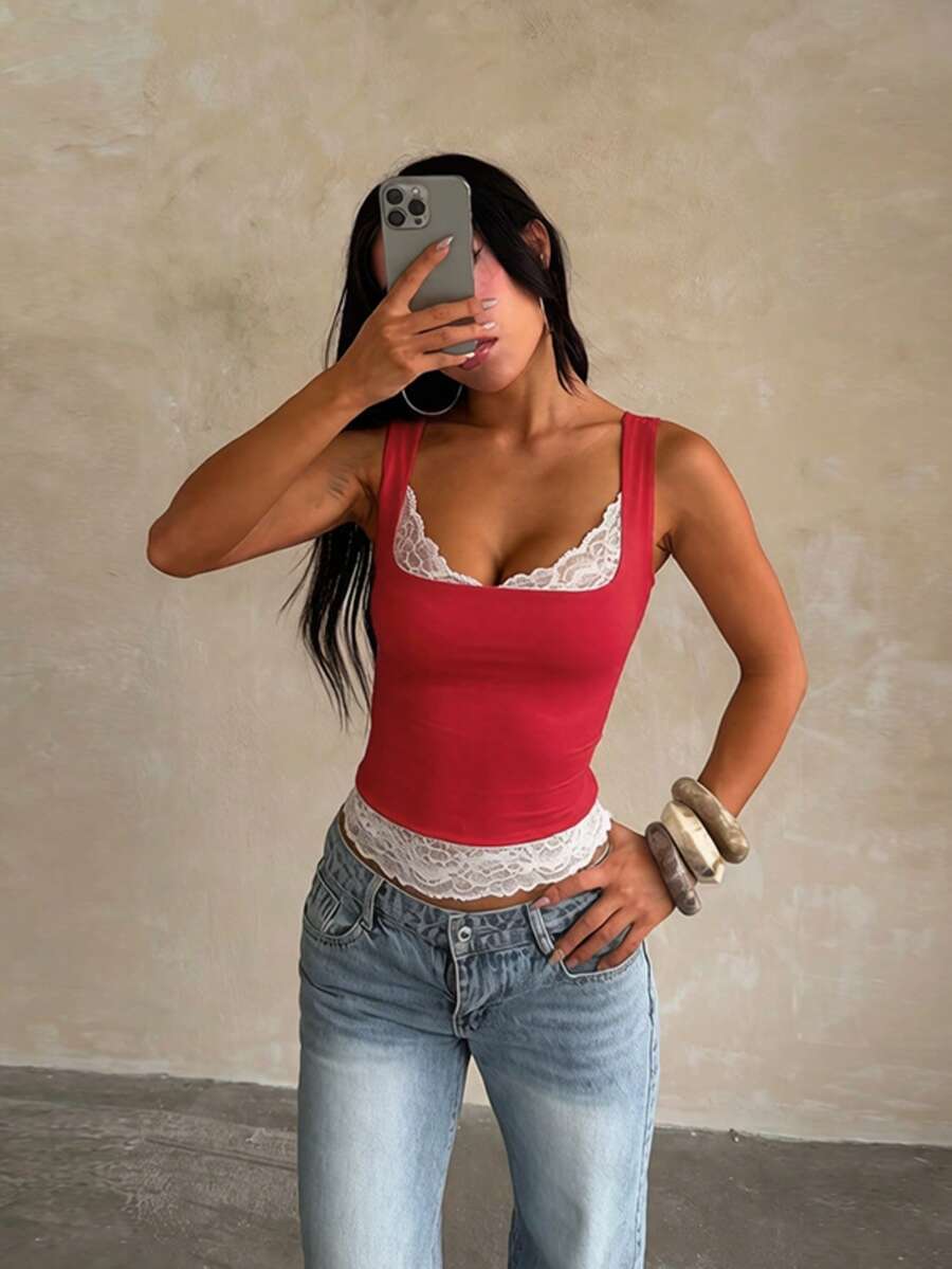 Women's white sleeveless crop tank top with contrast lace details, strap neckline, and graphic plant pattern in a slim fit.