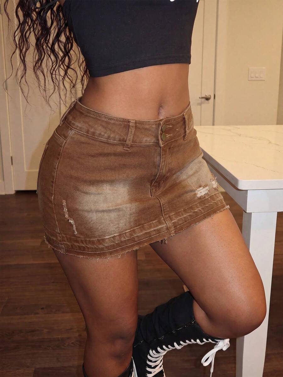 Women's black low waist bodycon mini skirt with button detail, pockets, and zipper closure