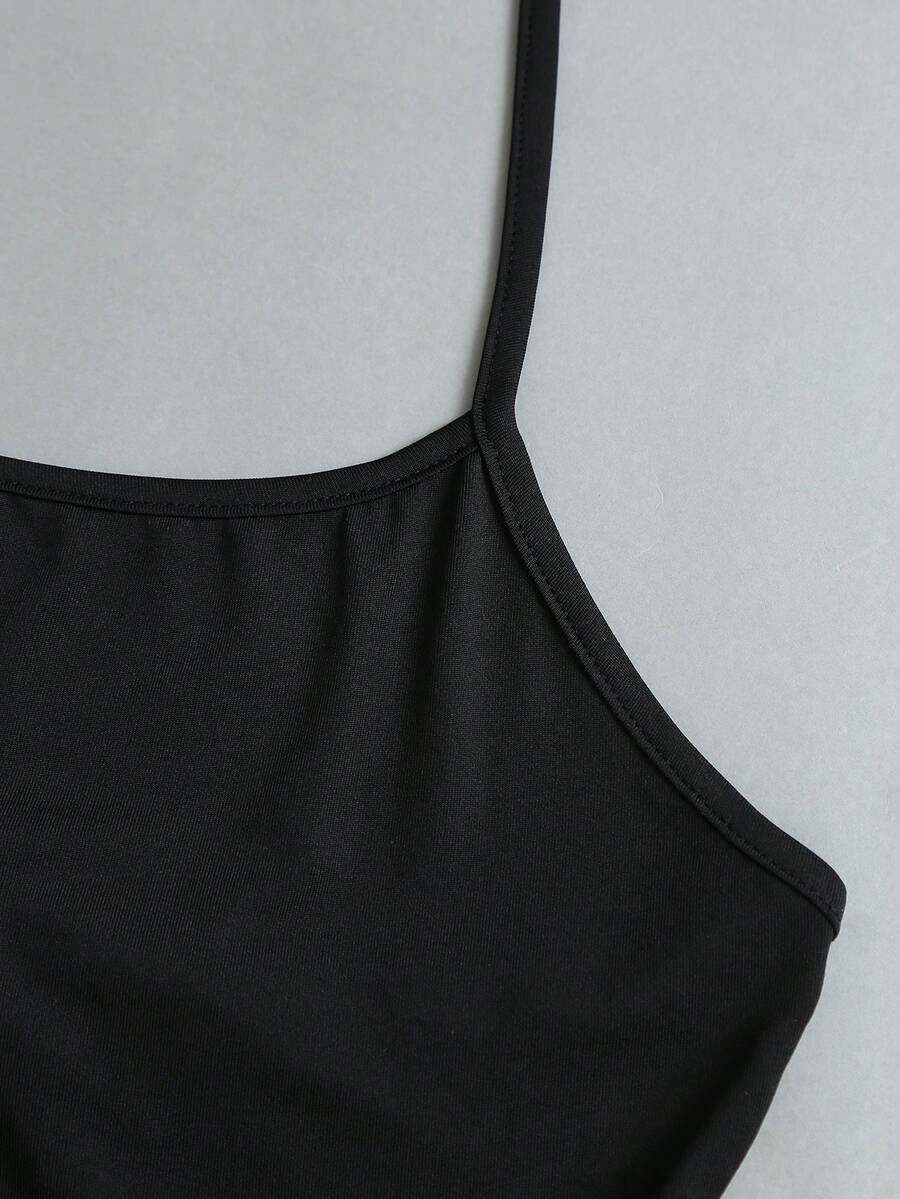 Women's striped tank top featuring an asymmetrical cold shoulder neckline and semi-sheer back.