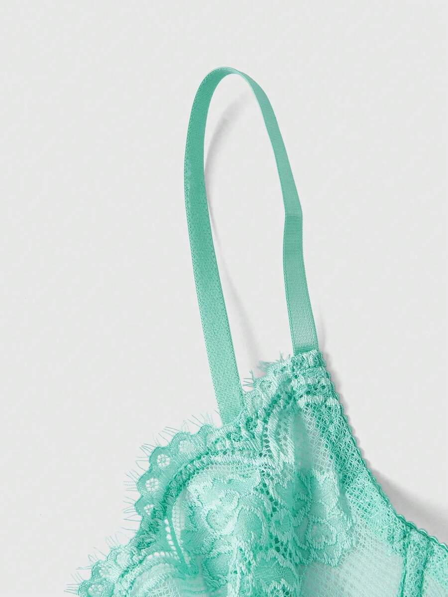 Sheer floral lace underwire triangle bra for women featuring adjustable straps and plunge cup design.