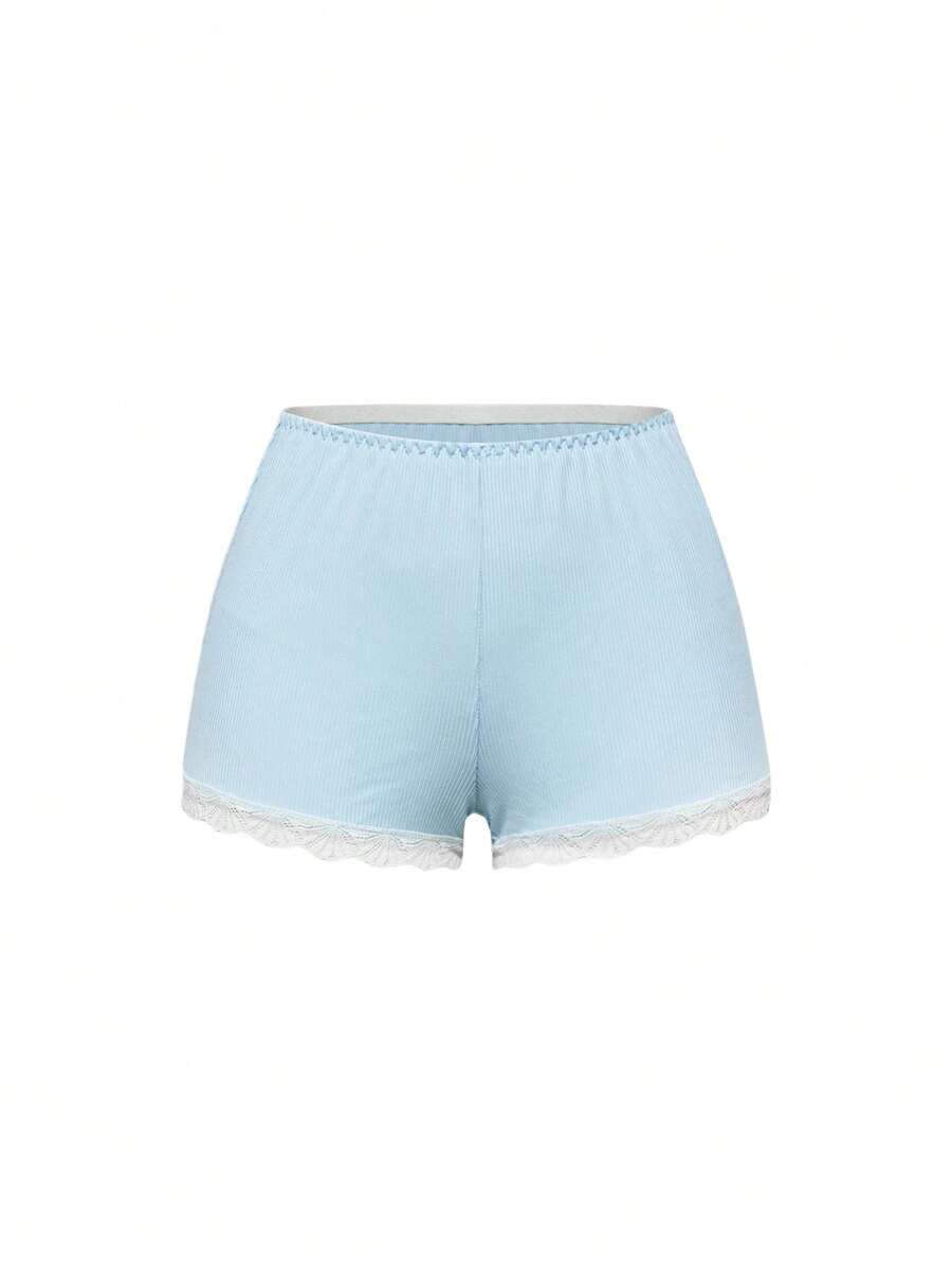 Ribbed lace camisole and shorts pajama set with spaghetti straps, bow detail, and contrast lace trim