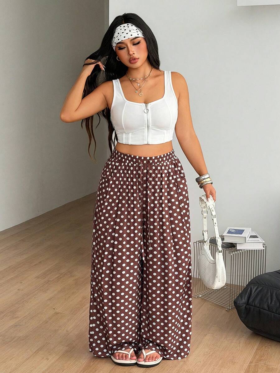 Plus size women's striped loose straight leg cropped pants with pleated detailing and side pockets