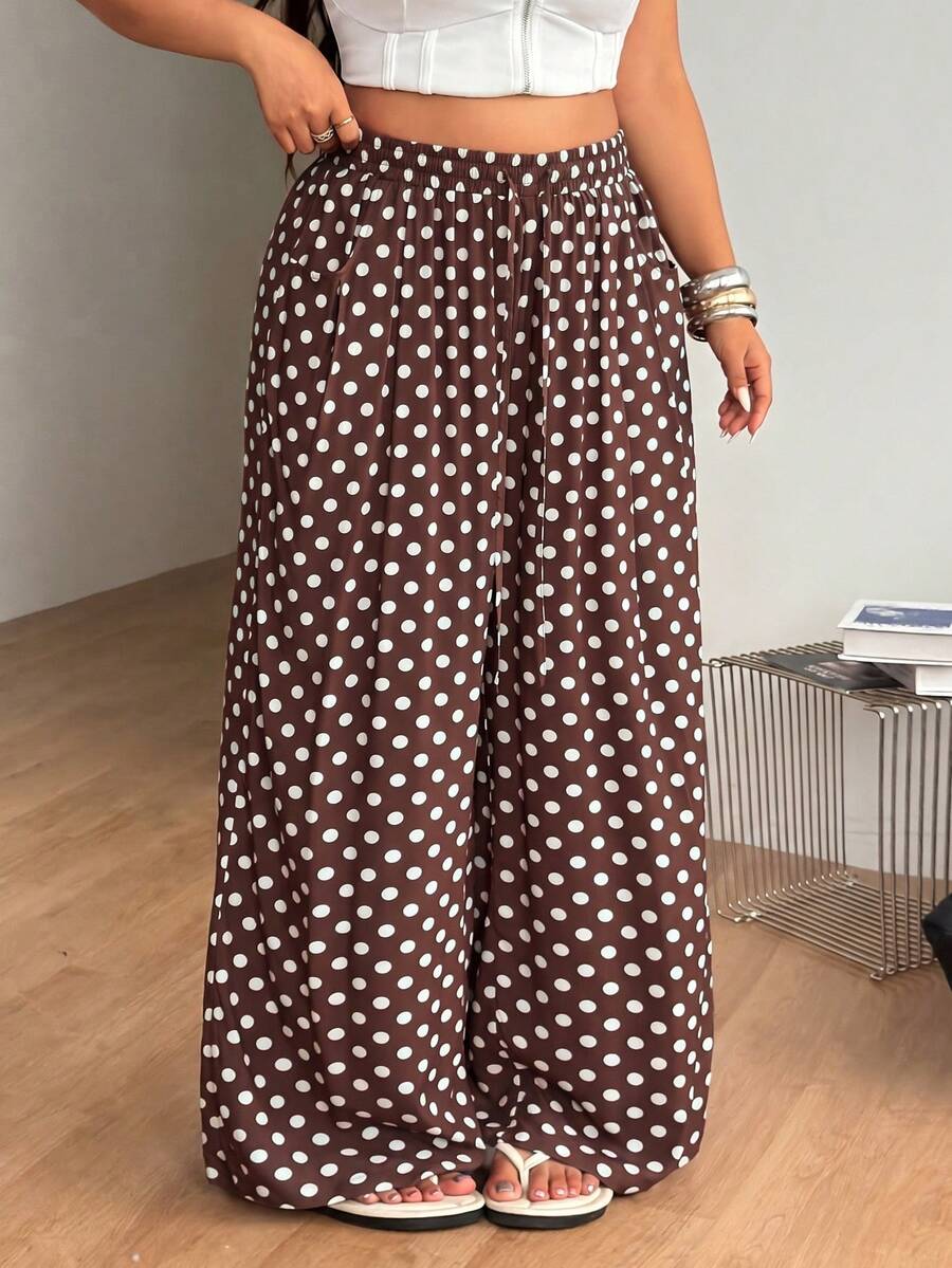 Plus size women's striped loose straight leg cropped pants with pleated detailing and side pockets