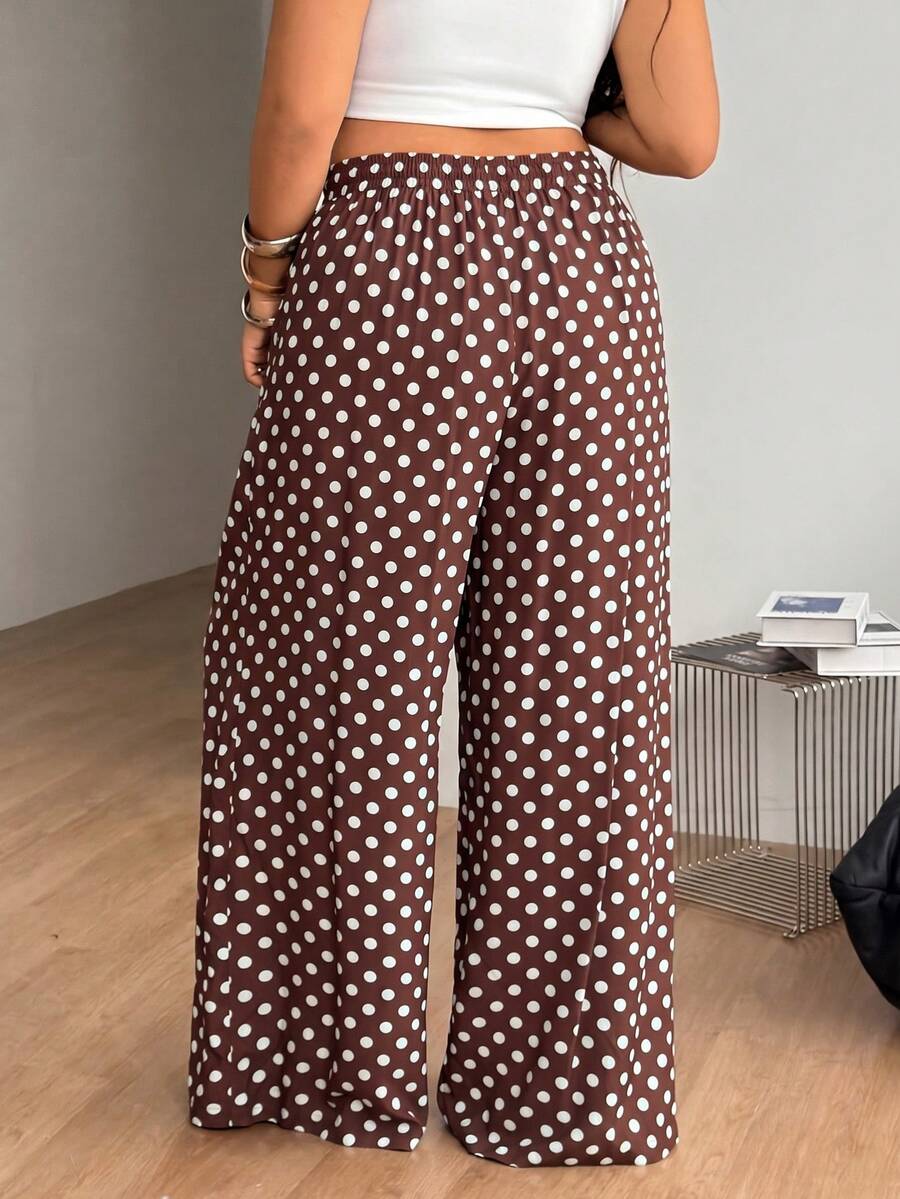Plus size women's striped loose straight leg cropped pants with pleated detailing and side pockets