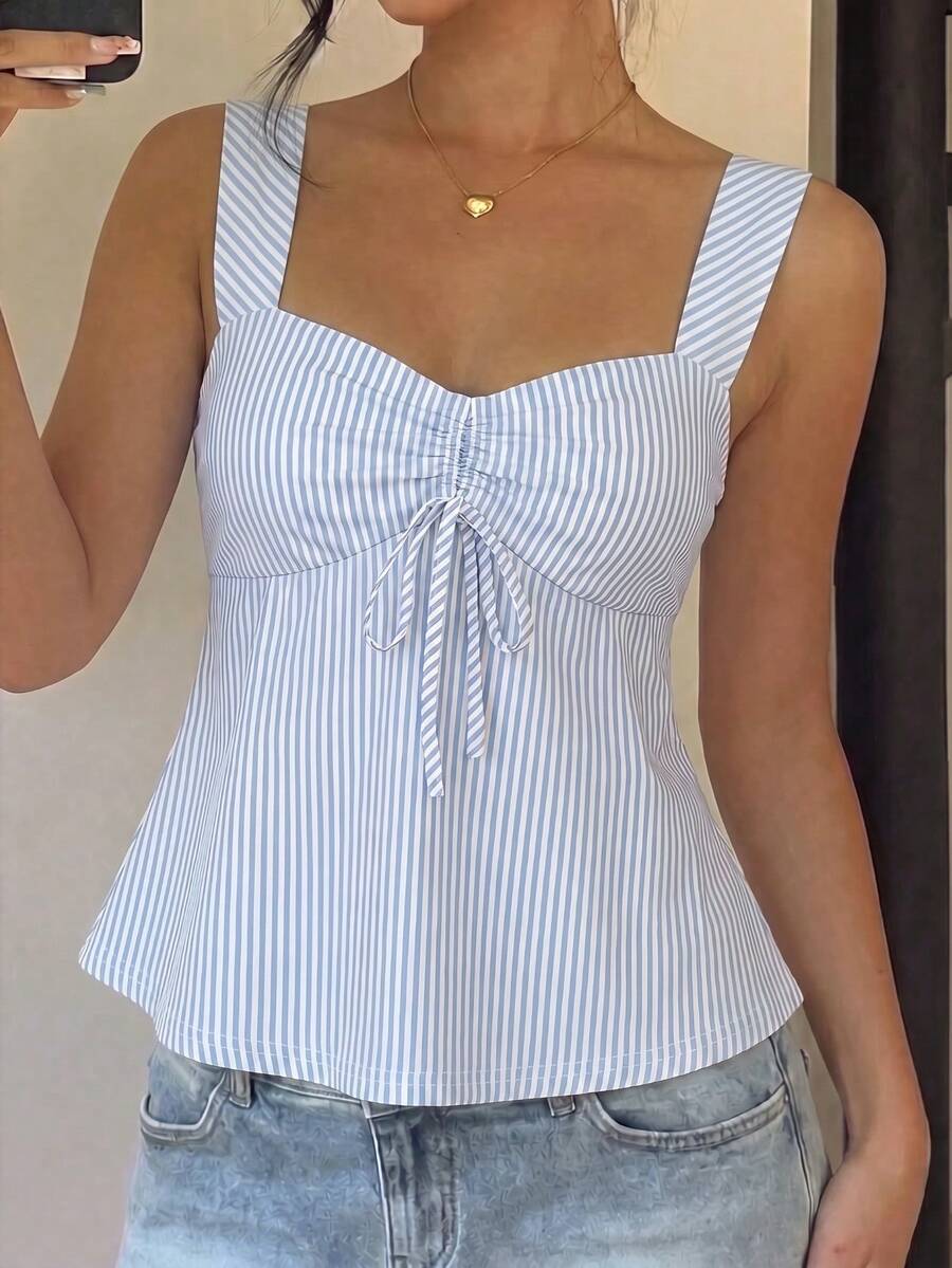 Women's striped camisole tank top with strap neckline, backless knot detail, cold shoulder styling, slim fit, and flared hem for casual vacation or daily wear.