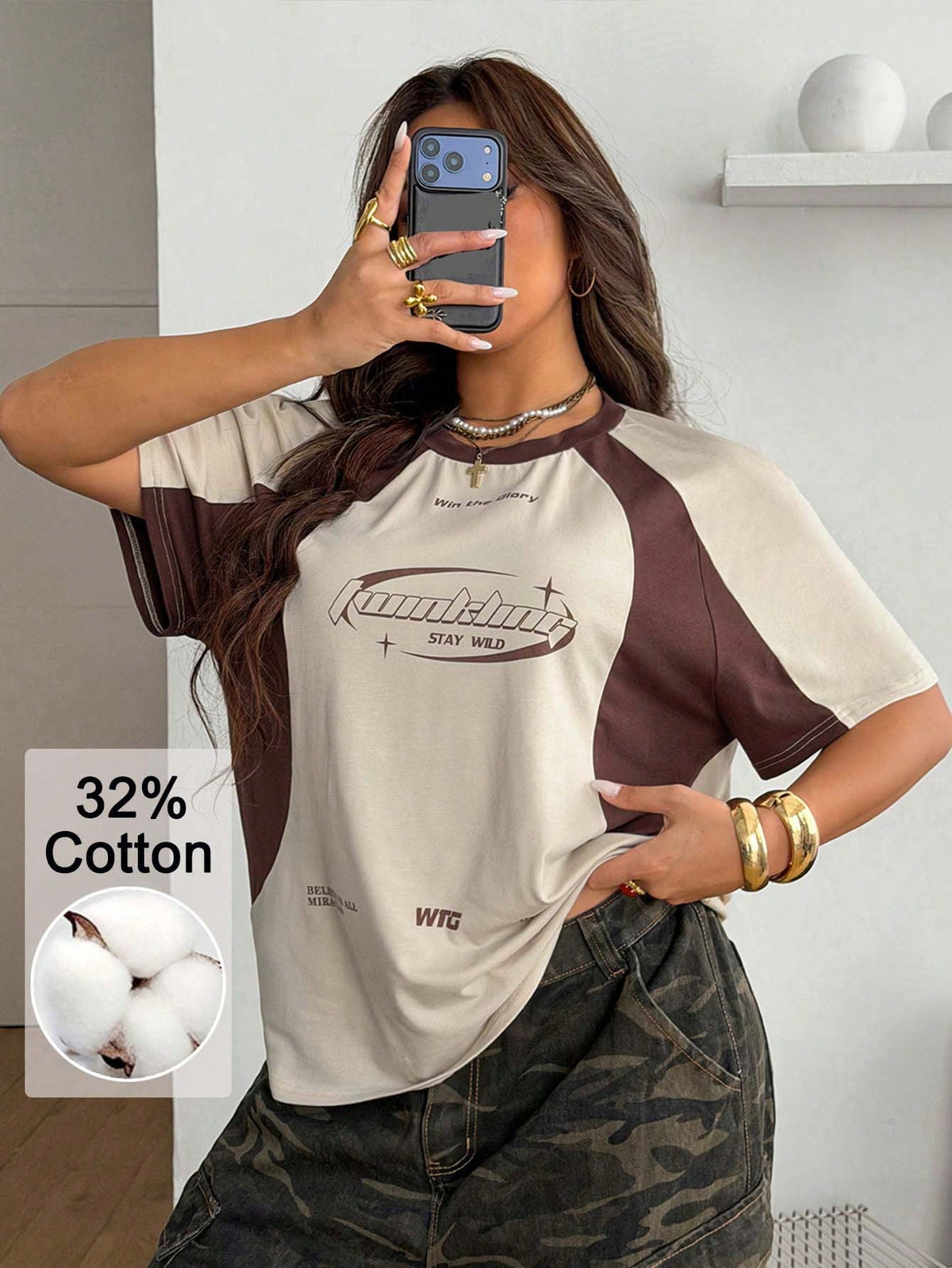 Unisex plus size oversized jersey t-shirt in brown featuring a round neck, short raglan sleeves with contrast binding, and a front letter graphic print.
