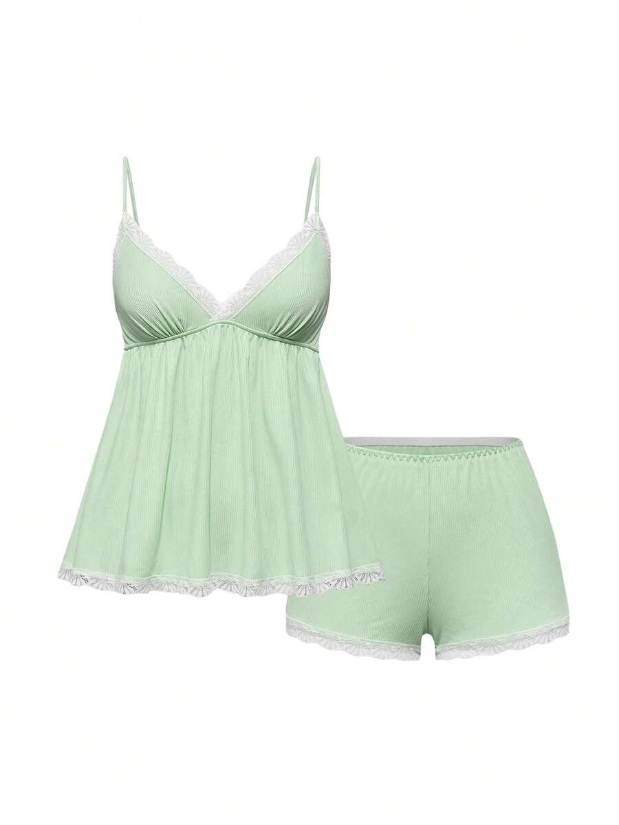 Ribbed lace camisole and shorts pajama set with spaghetti straps, bow detail, and contrast lace trim