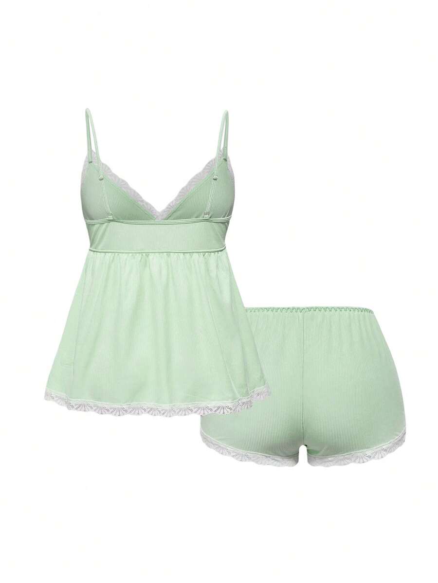 Ribbed lace camisole and shorts pajama set with spaghetti straps, bow detail, and contrast lace trim
