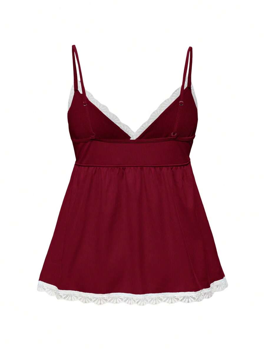Ribbed lace camisole and shorts pajama set with spaghetti straps, bow detail, and contrast lace trim