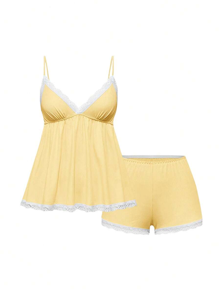 Ribbed lace camisole and shorts pajama set with spaghetti straps, bow detail, and contrast lace trim