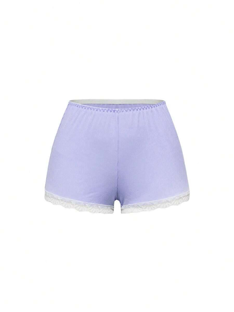 Ribbed lace camisole and shorts pajama set with spaghetti straps, bow detail, and contrast lace trim