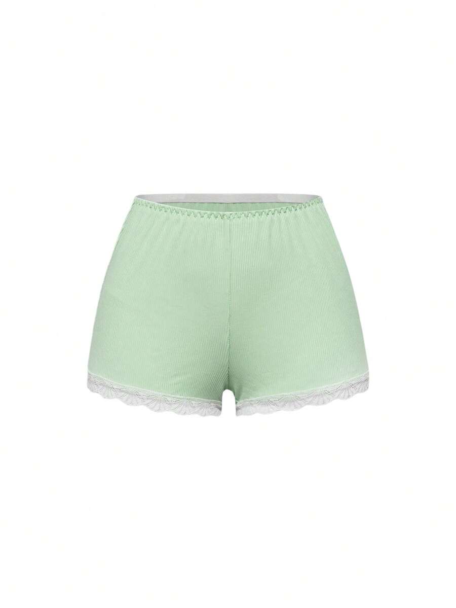 Ribbed lace camisole and shorts pajama set with spaghetti straps, bow detail, and contrast lace trim